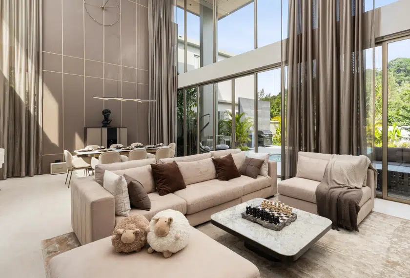 Elegant living room with high ceilings and natural light.