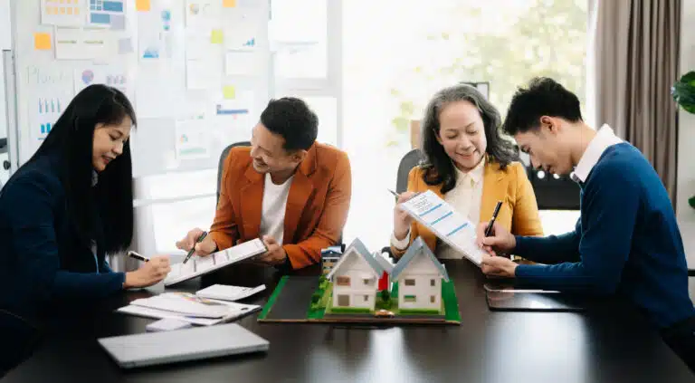 Property Management Services in Phuket: Real estate agents discussing property management services.