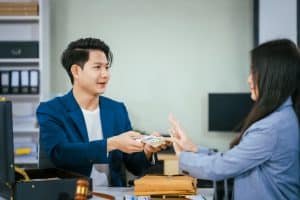 Rent Collection in Phuket: Landlord handing rent payment to tenant.