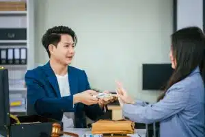 Rent Collection in Phuket: Landlord handing rent payment to tenant.