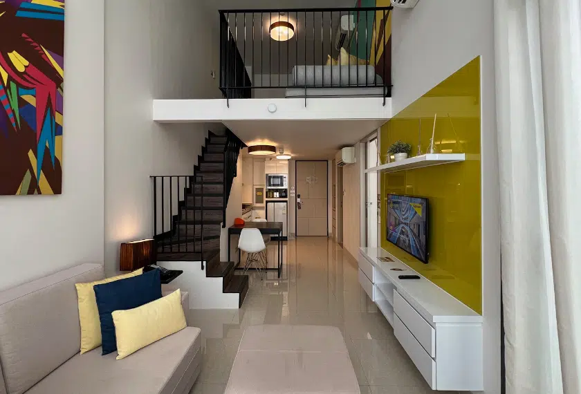 Condo interior with mezzanine and kitchen