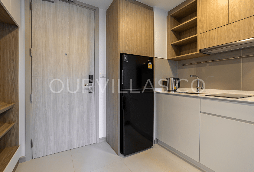 Laguna condo for sale: Compact kitchen by entry door