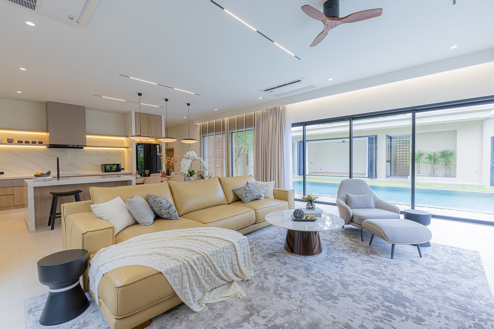 Modern living area with pool view and stylish décor