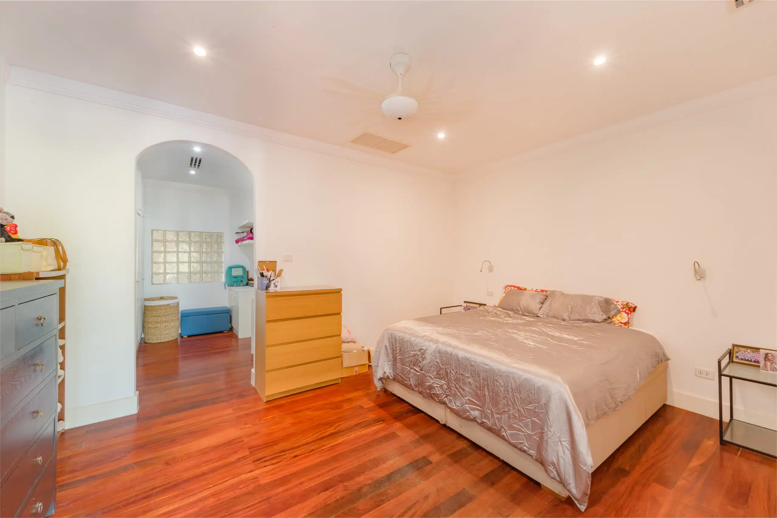 Master bedroom with dressing nook and wood floors