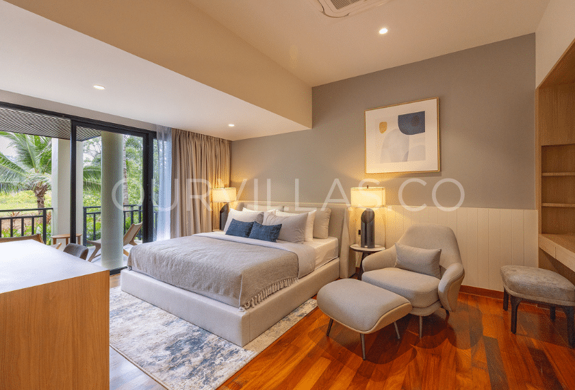 Lakeview Villa in Phuket: Master bedroom with balcony and modern armchair