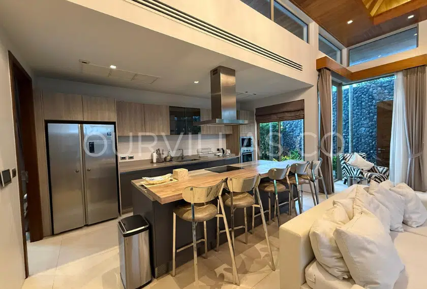 Modern kitchen with breakfast bar in Phuket villa
